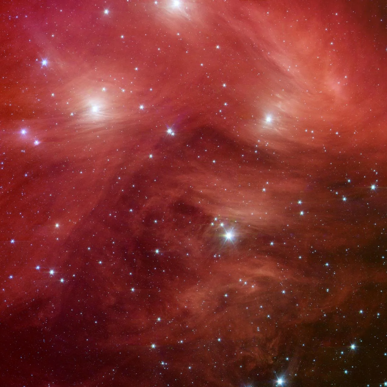 The Pleiades star cluster in a Spitzer infrared image. NASA/JPL-Caltech. Colour mapped infrared data, not a parallax measurement.